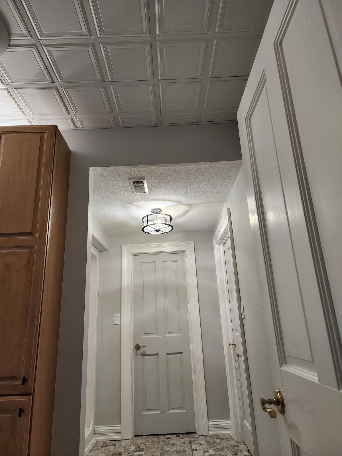 Interior hallway remodel with coffered ceiling
