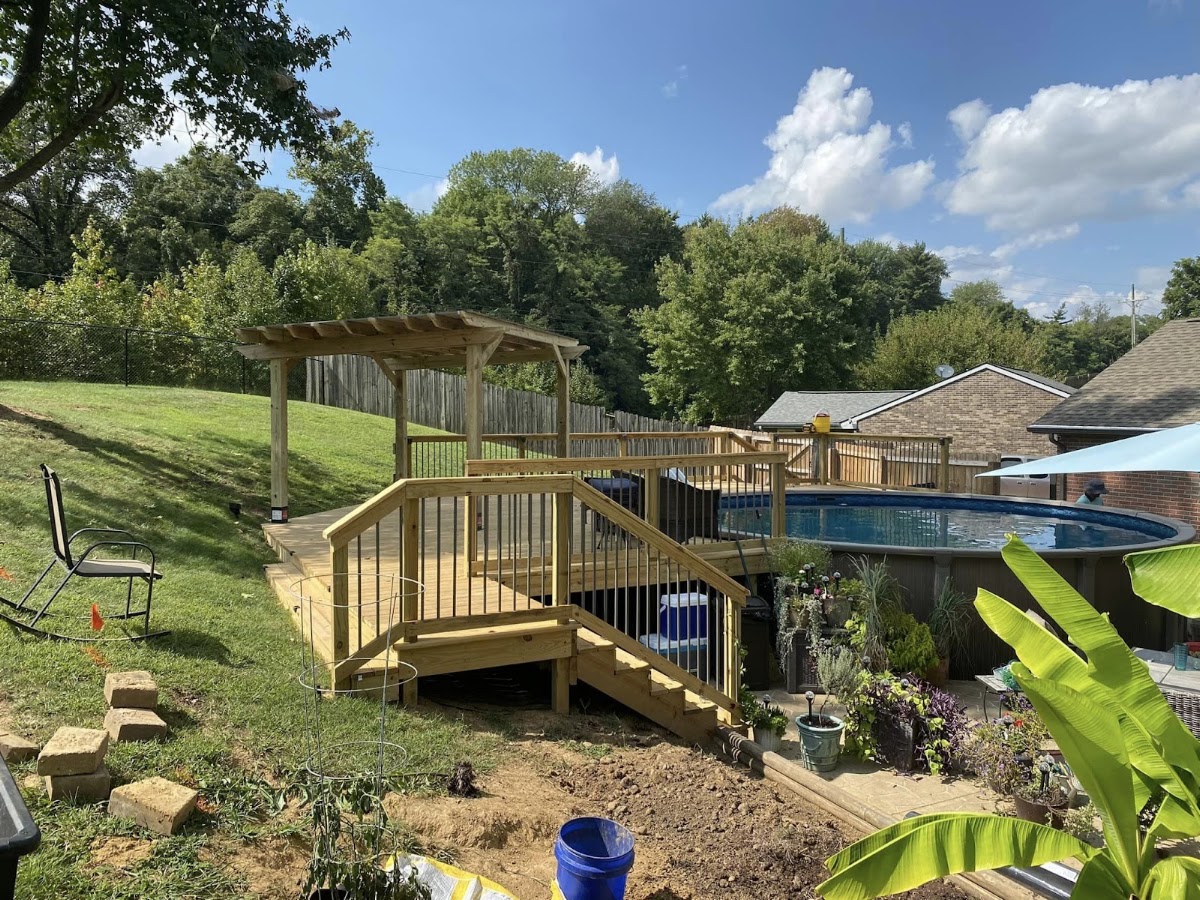 Pool deck with pergola in a garden
